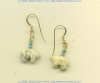 Fossil coral Zuni bear 14K gold fill leverback earrings with turquoise heishi gemstone accents.				
 - Click for a larger picture